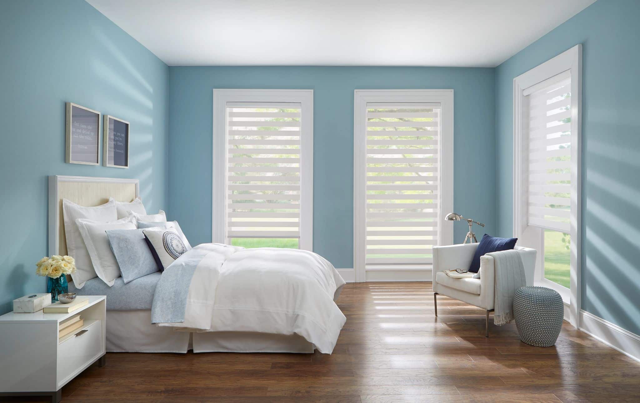 Banded shades on a window, alternating sheer and opaque fabric.