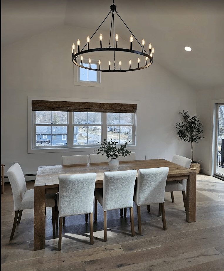Custom window treatments enhance the wood elements in a dining room.