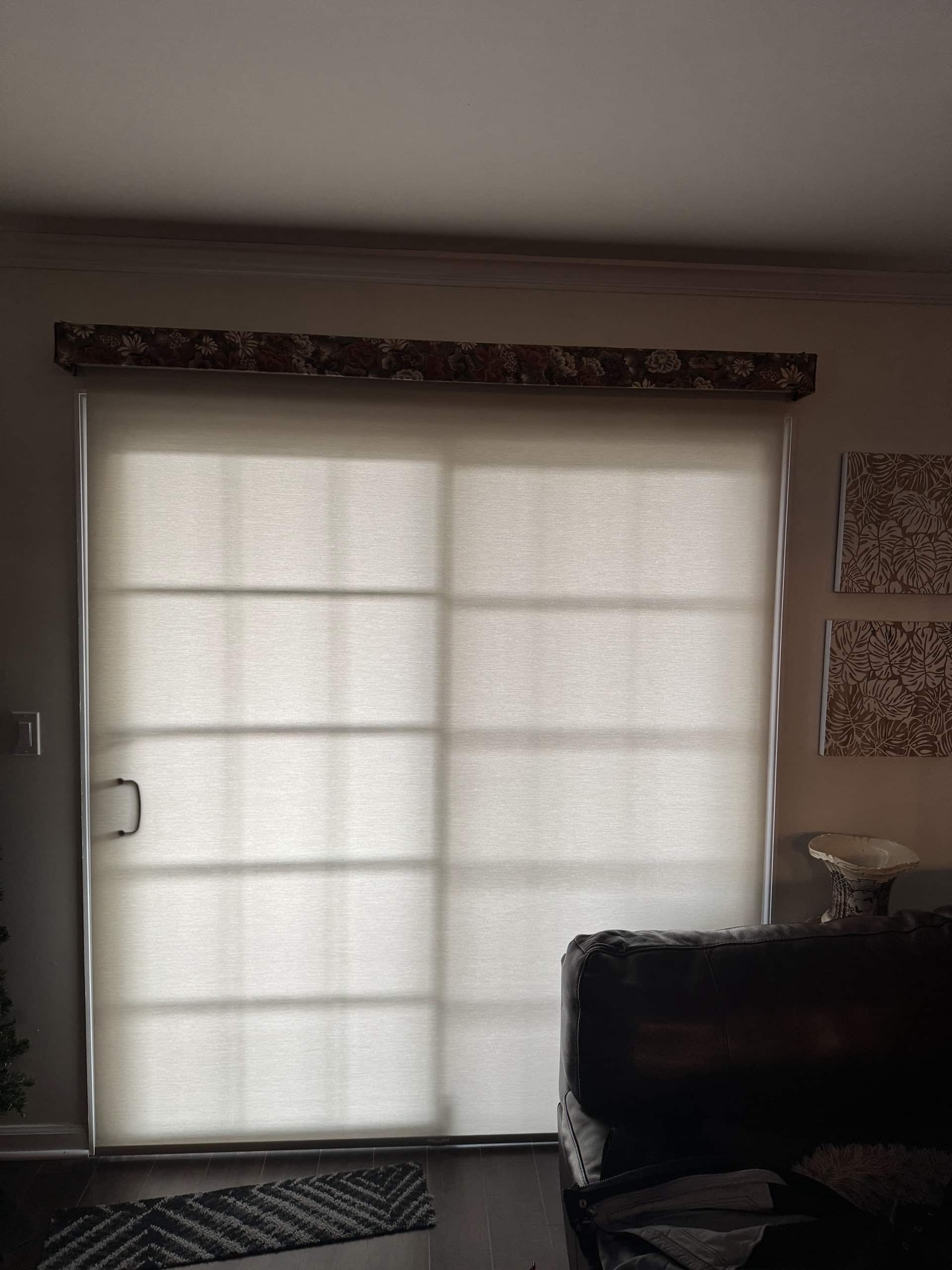 Large roller shade over a sliding glass door in a Morristown, Morris County NJ home