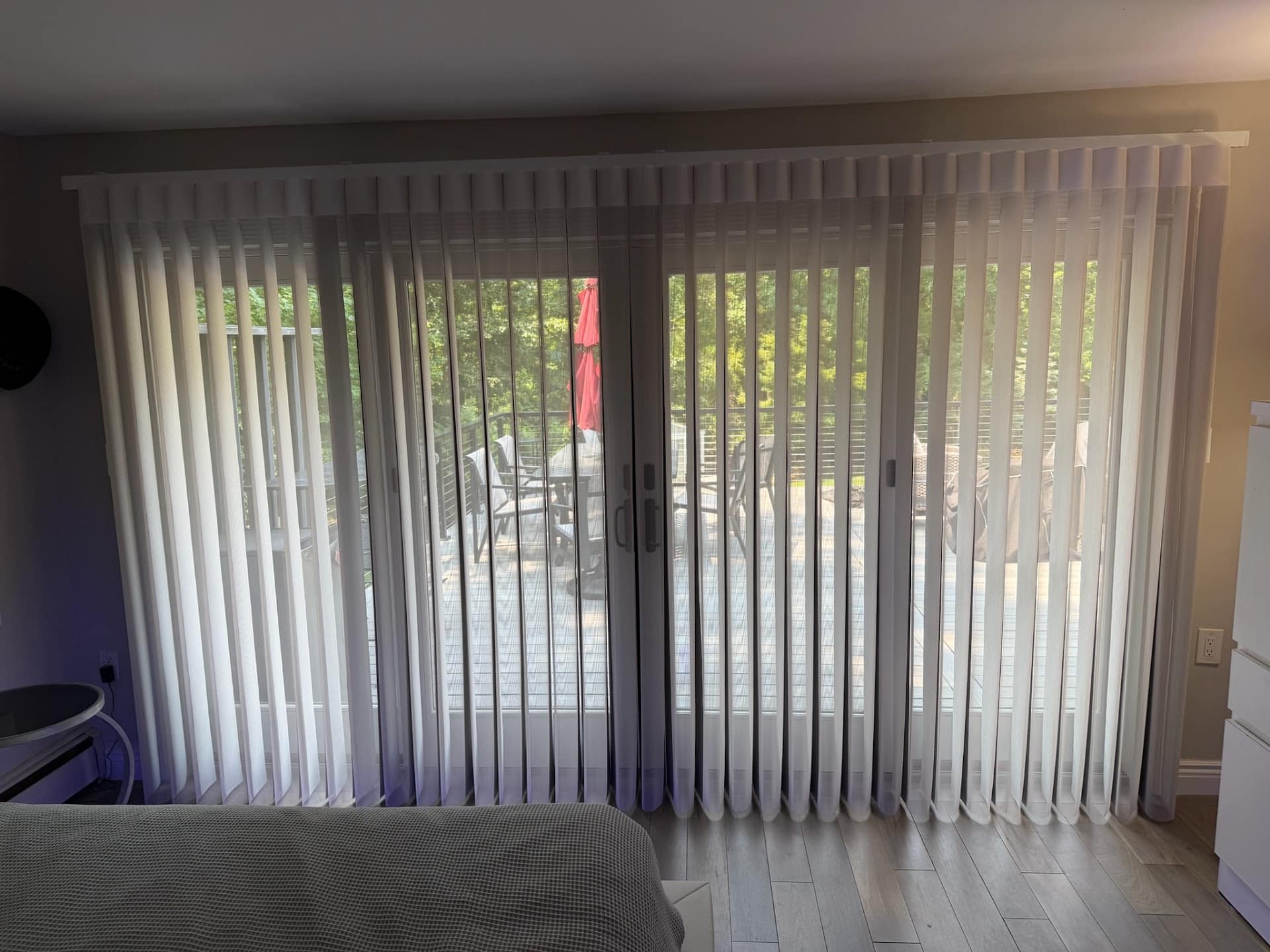 Motorized smart drapes beside a sliding glass door in Wayne, New Jersey